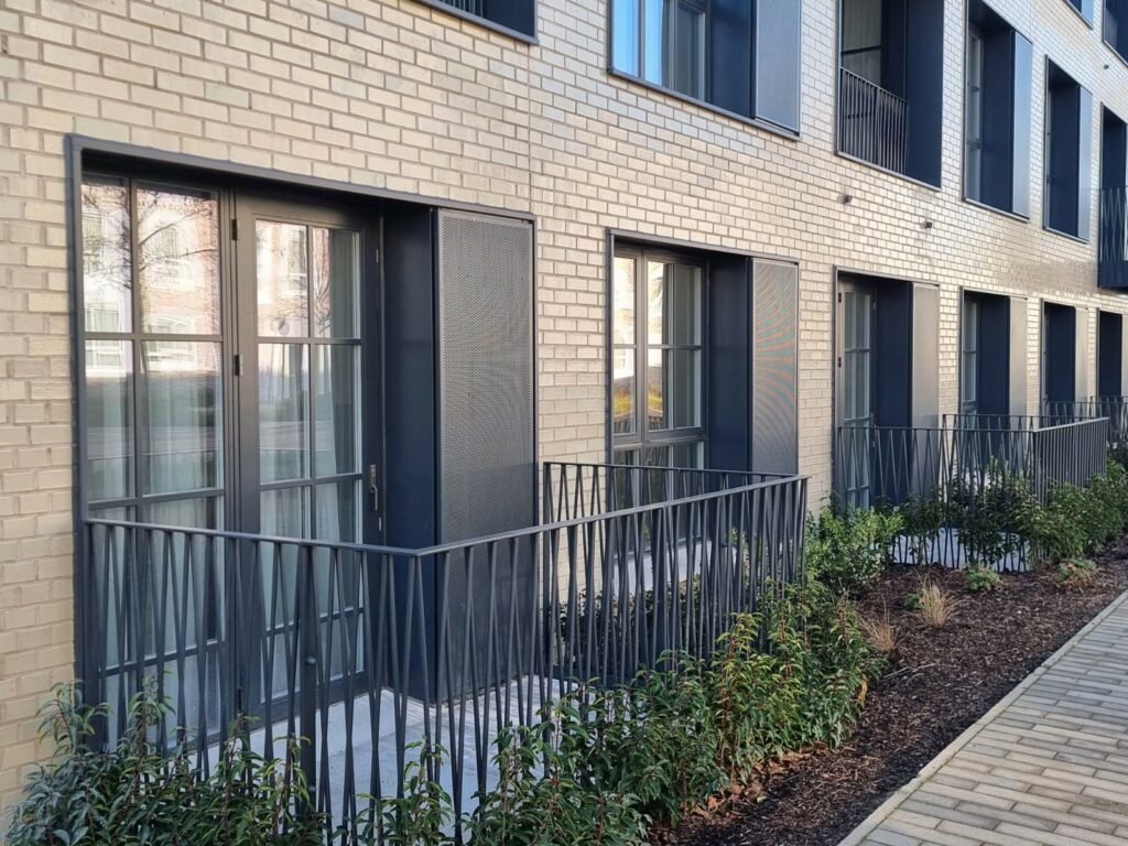acoustic vents on each window of a medium rise block