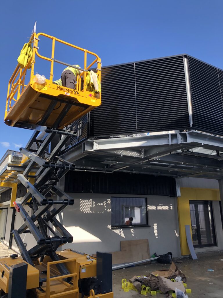 Gallery 104 black tek louvres being installed
